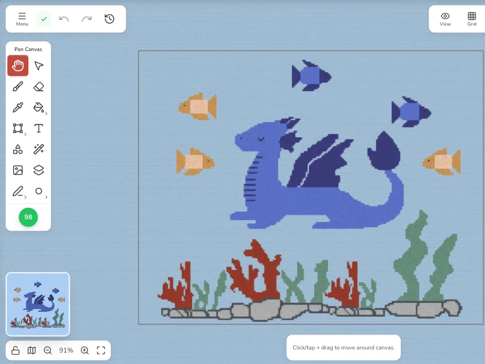 Stitchmateのエディターで開いたドラゴンの図案。魚、サンゴ、岩と青いドラゴン